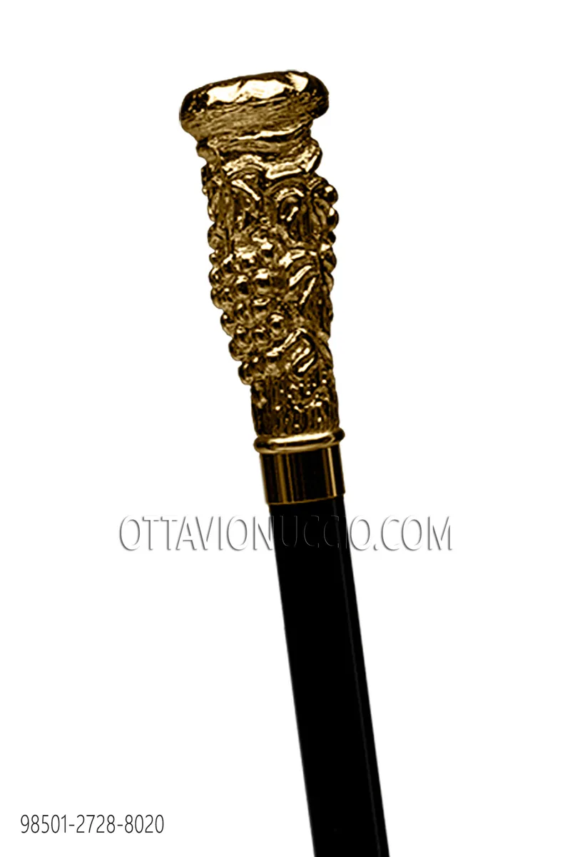 Black stick with gold knob